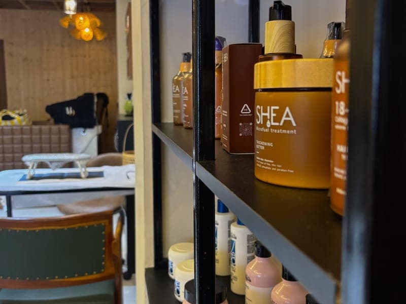 Hair and skin care products on the shelves at Hair Official